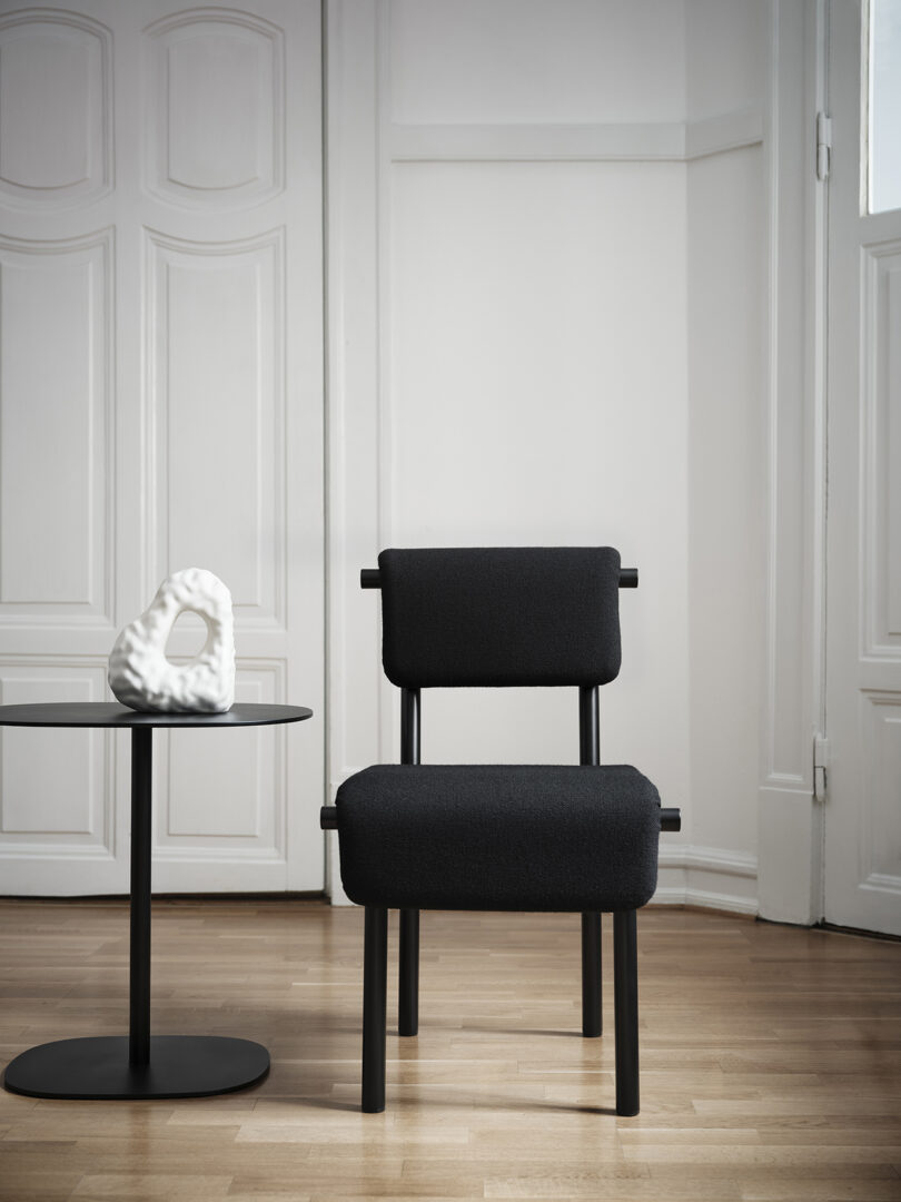 black partially padded dining chair