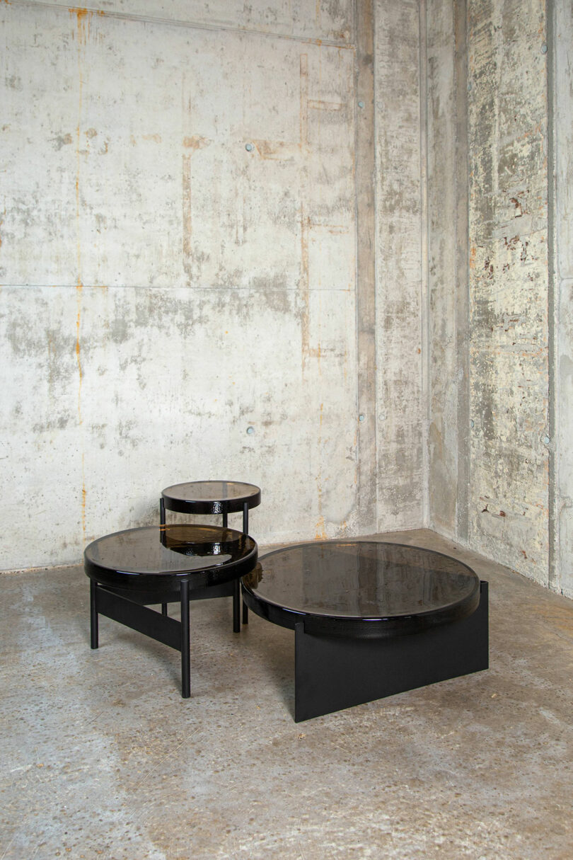 A series of dark brown nesting tables.
