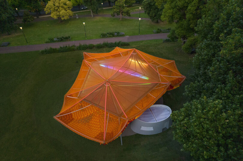 overhead view of orange net-like outdoor pavilion