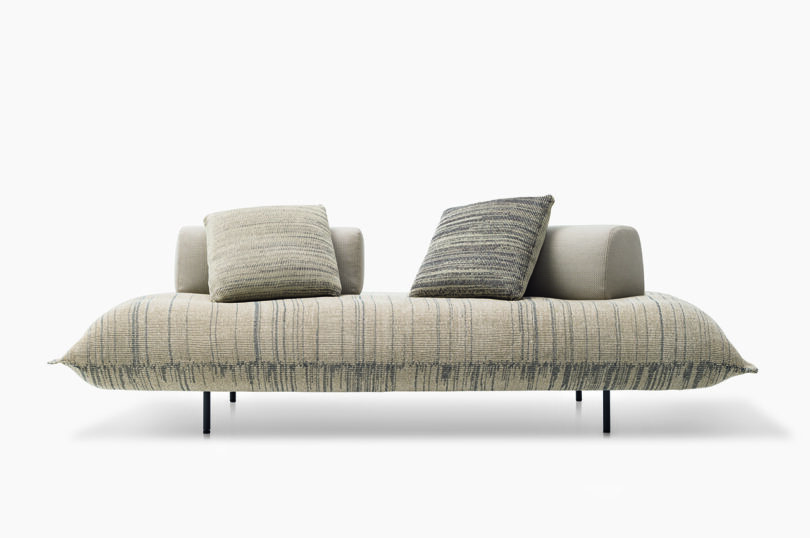 neutral toned cushioned platform seating with pillows