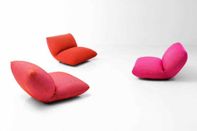 three debased lounge chairs connected achromatic background