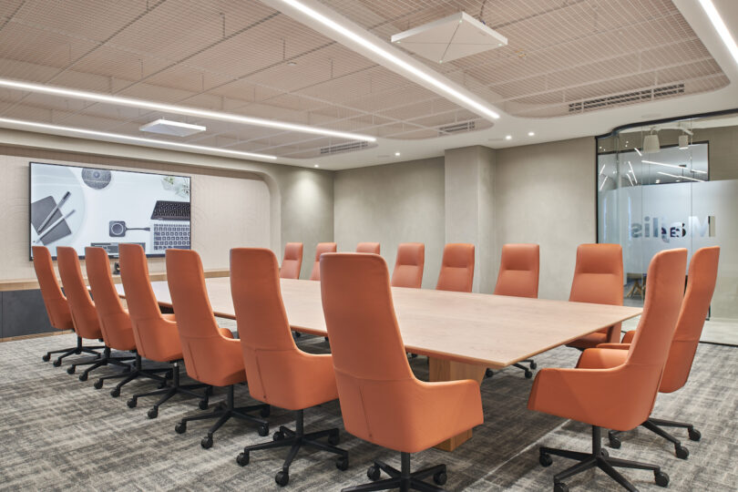 large conference room with orange chairs