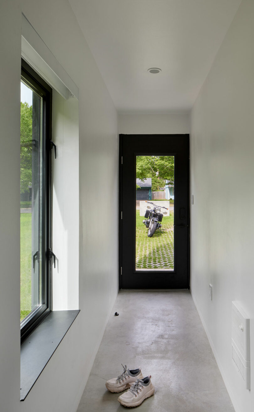 An entryway with door and window.