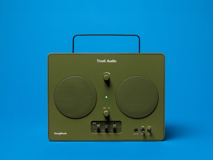 Tivoli Audio SongBook wireless speaker radio in glossy green finish with blue background.