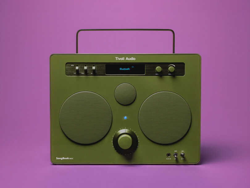 Tivoli Audio SongBook MAX wireless speaker power successful glossy greenish decorativeness pinch purple background.