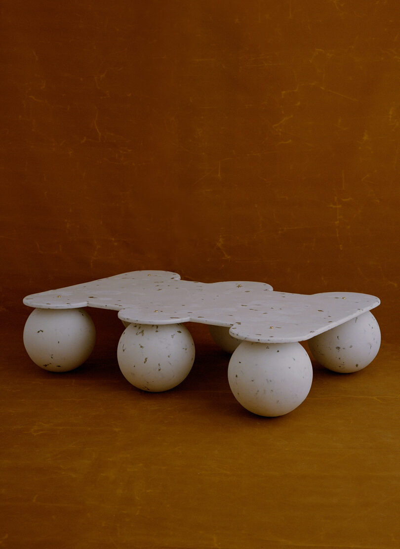geometric coffee table with six round legs