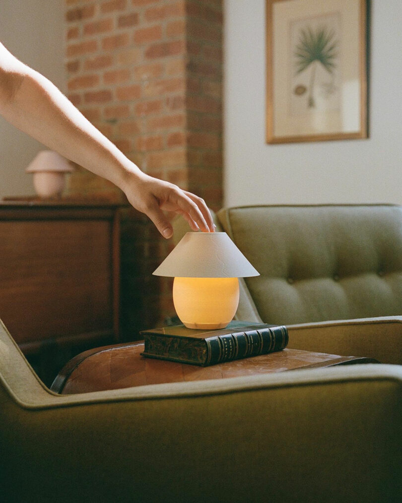 A mini orb-shaped lamp pinch accepted shadiness being turned on.