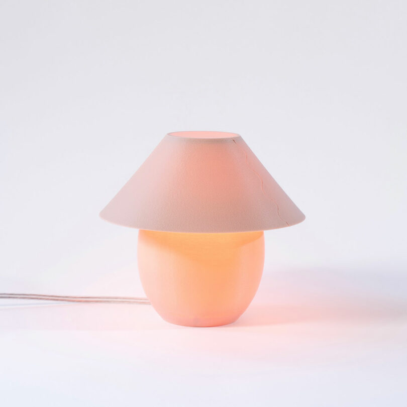 A tiny, blush colored orb-shaped lamp pinch accepted shadiness and an ambient glow.