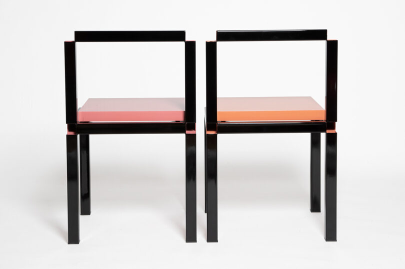 zero-thickness black framed chairs with pink and peach seats on white background