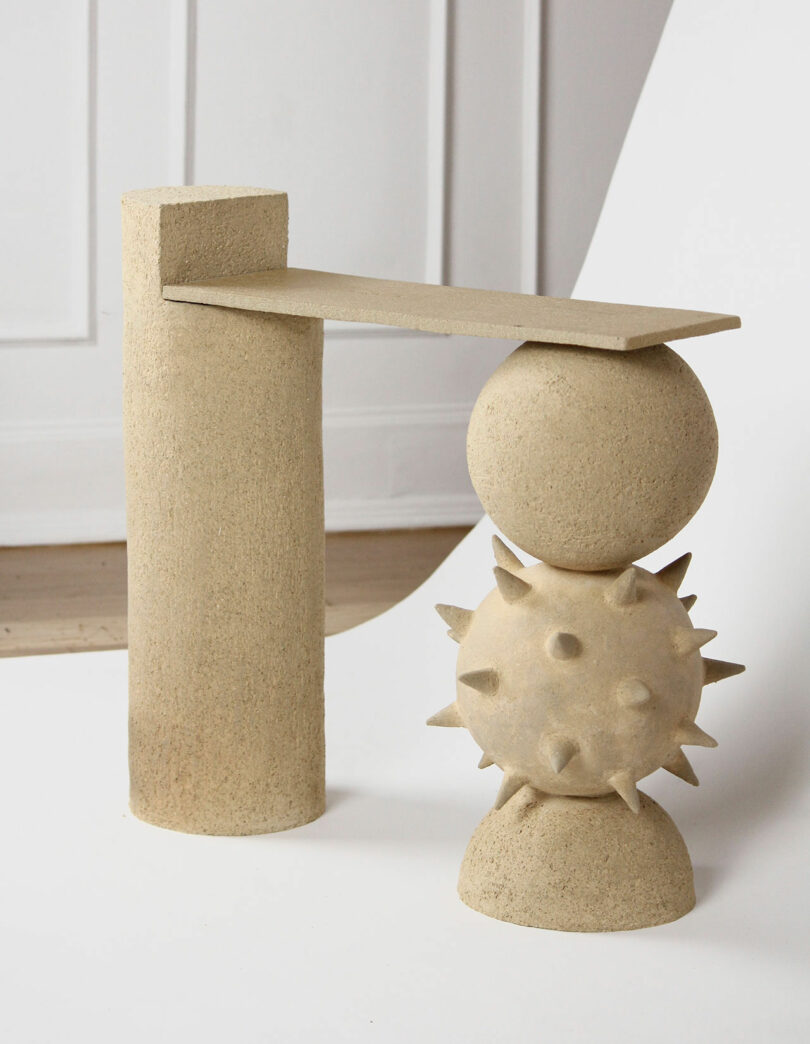 beige ceramic bench with spiked ball