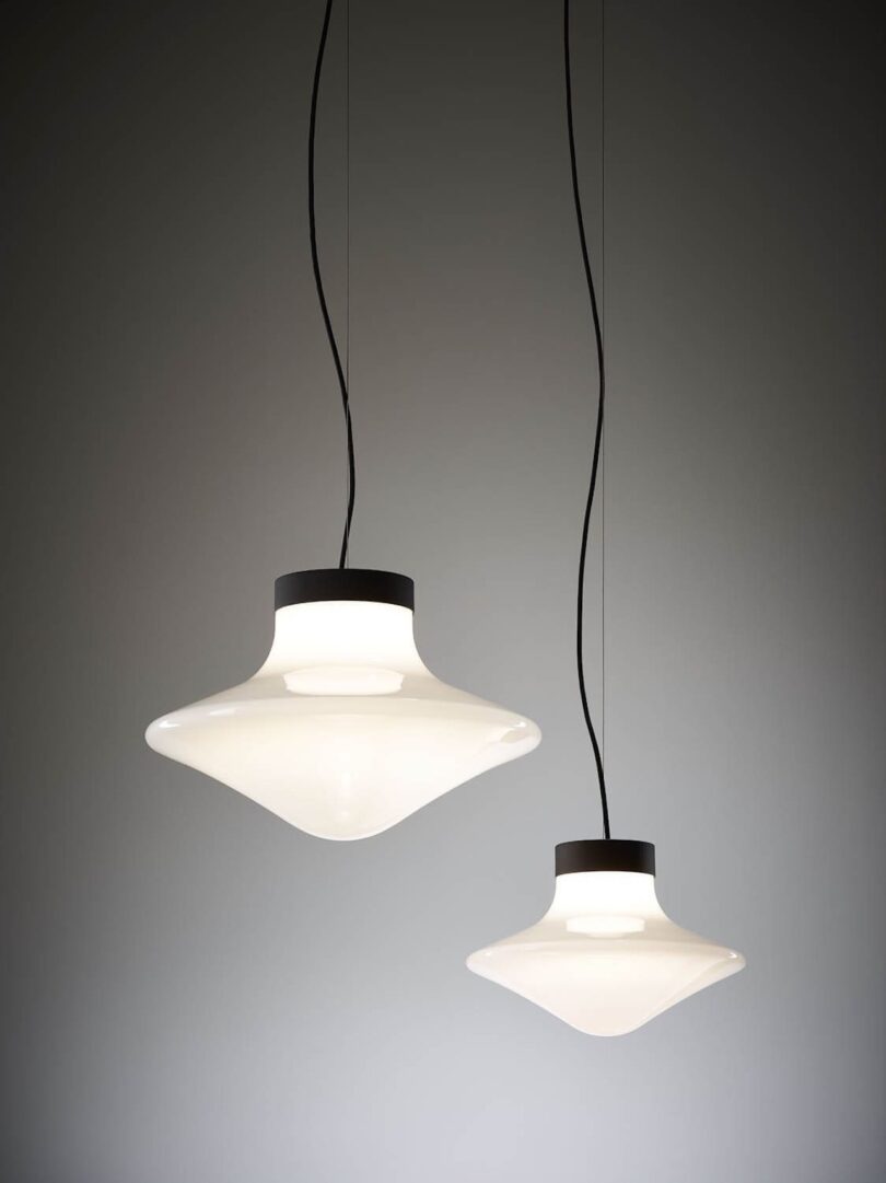 a pair of spinning top pendant lights