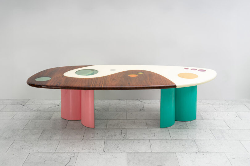 long coffee table with pink and green legs