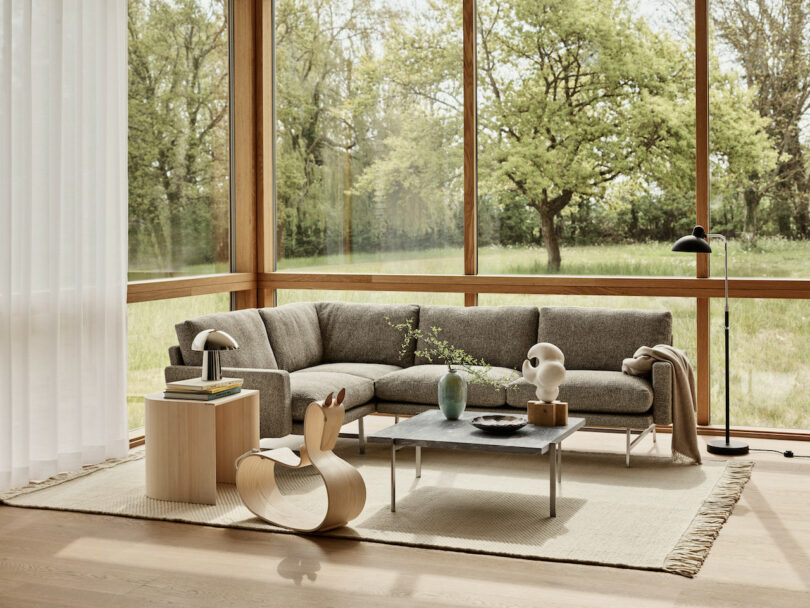 rocking horse in a living room with floor-to-ceiling windows