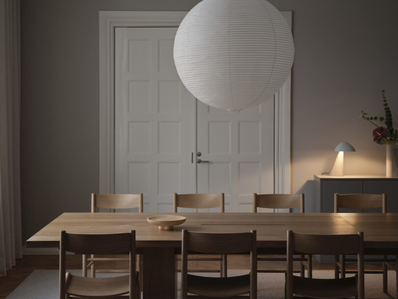 long conference table under a paper pendant light