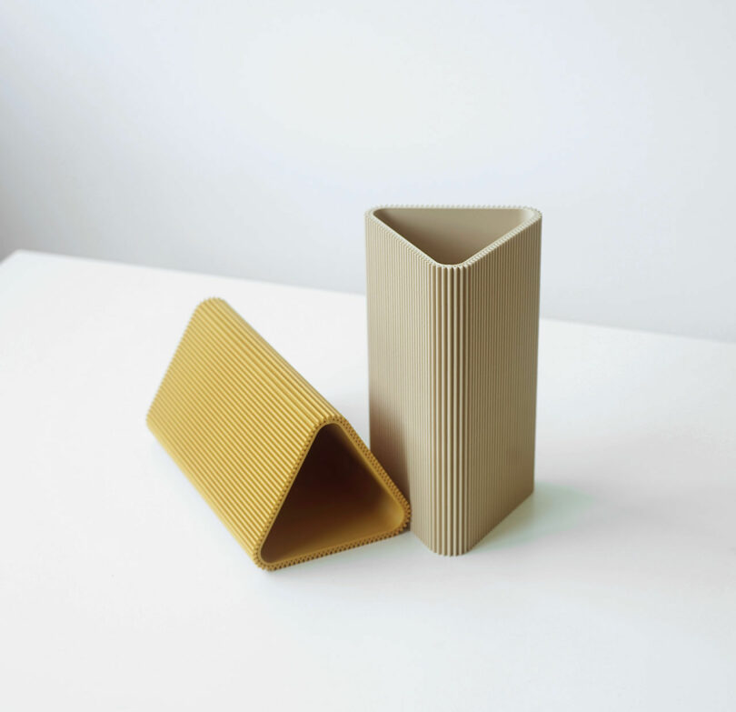 yellow and beige triangle vases