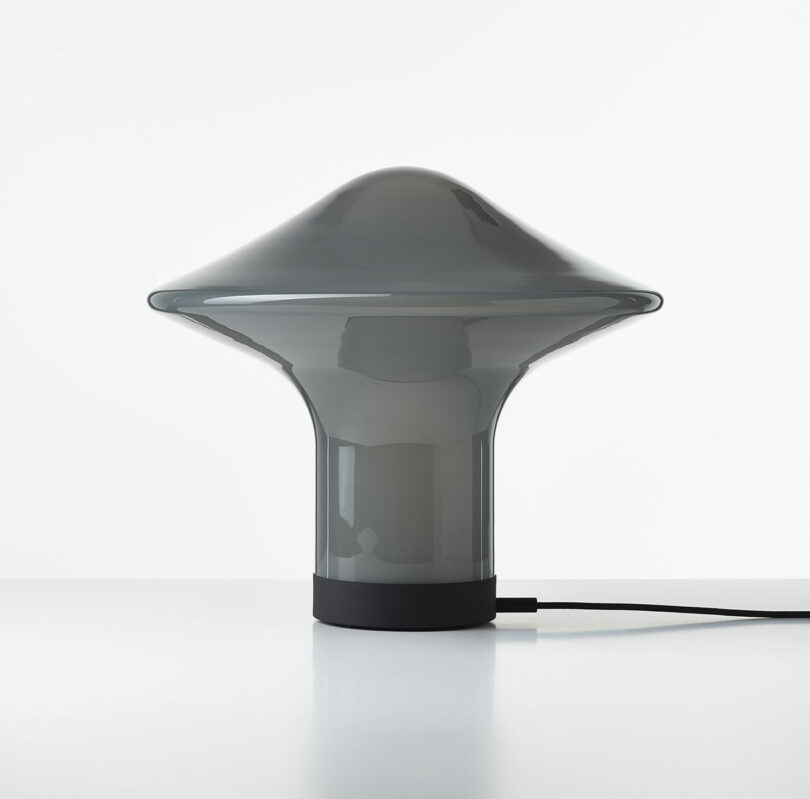 gray opal glass lamp shaped like a spinning top