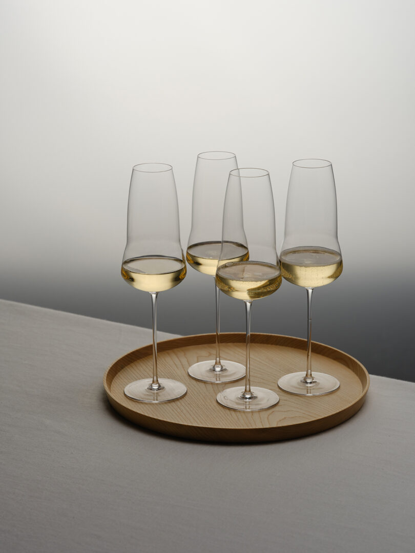 four champagne flutes on a tray
