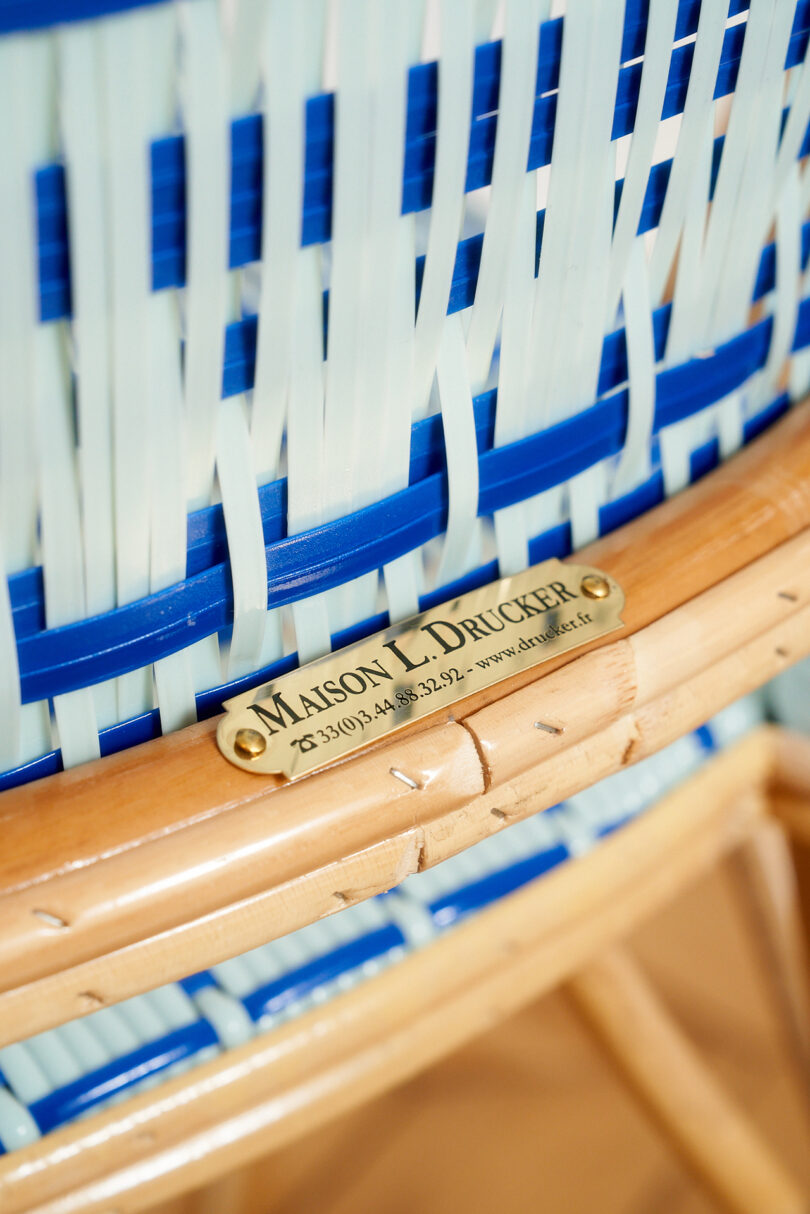detail of blue and white caned cafe chair