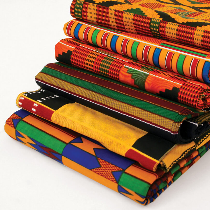 stack of colorful patterned Kente cloth