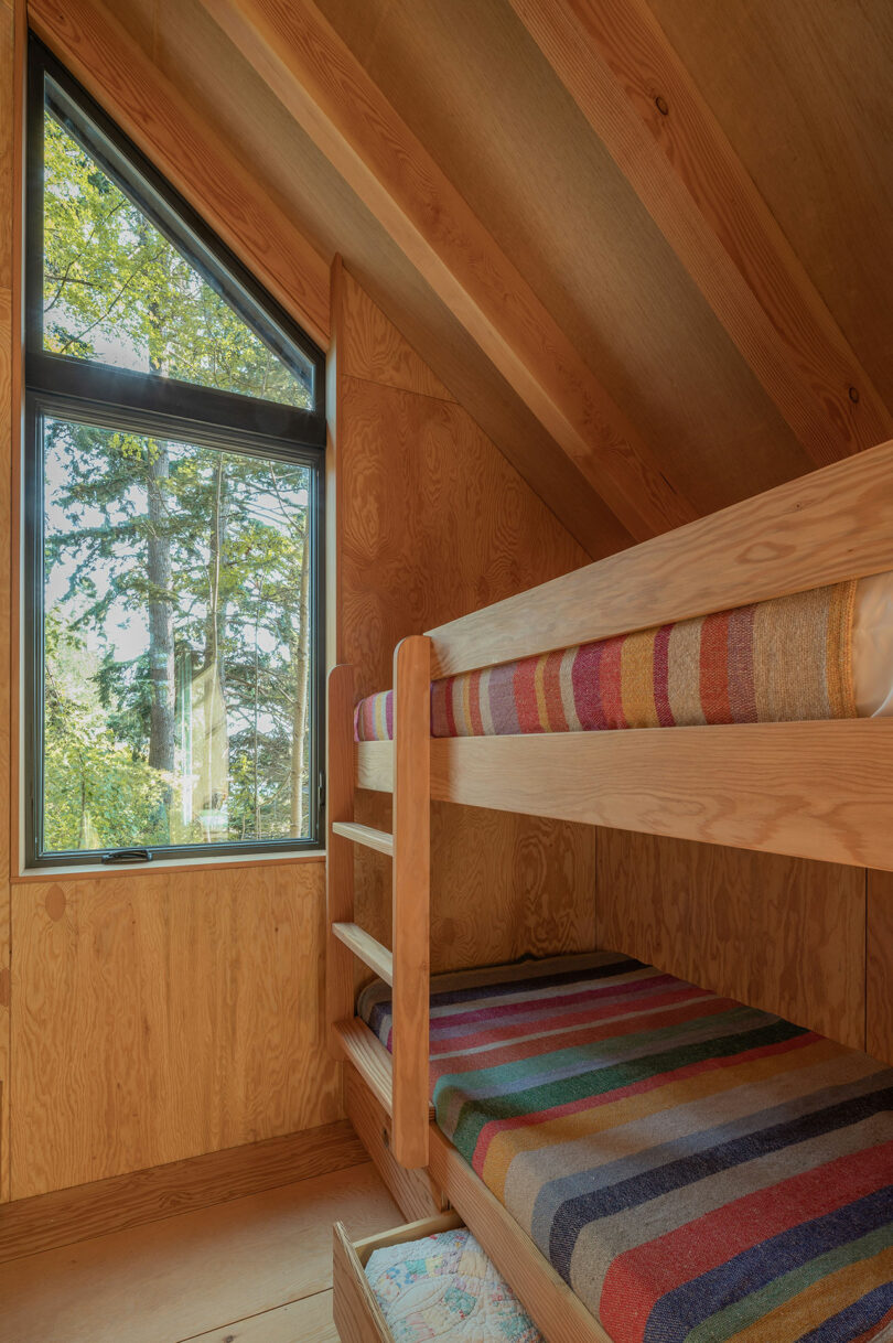 partial angled view of rustic modern bunkbeds in cabin