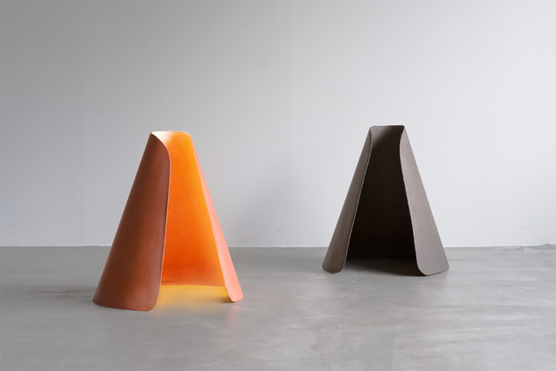 two illuminated conical light artworks