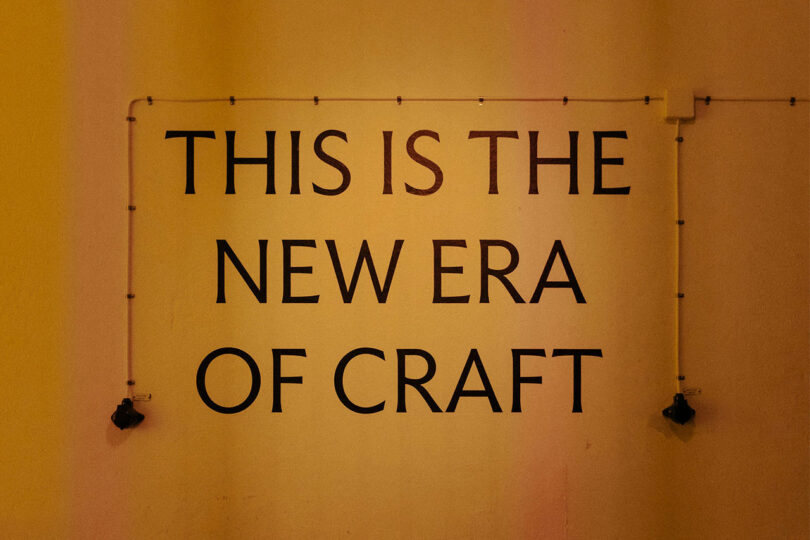 Slogan on a wall that says "this is the new era of craft"