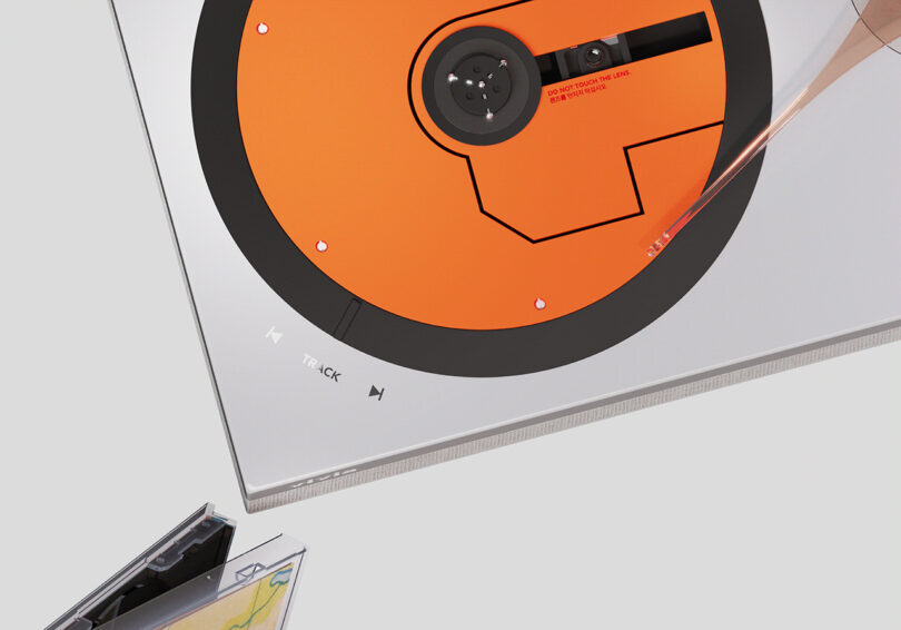Close up of Vivia turntable for compact discs laser reader platter and tone arm, alongside Track touch capacitive controls labeled on the left corner of the player.