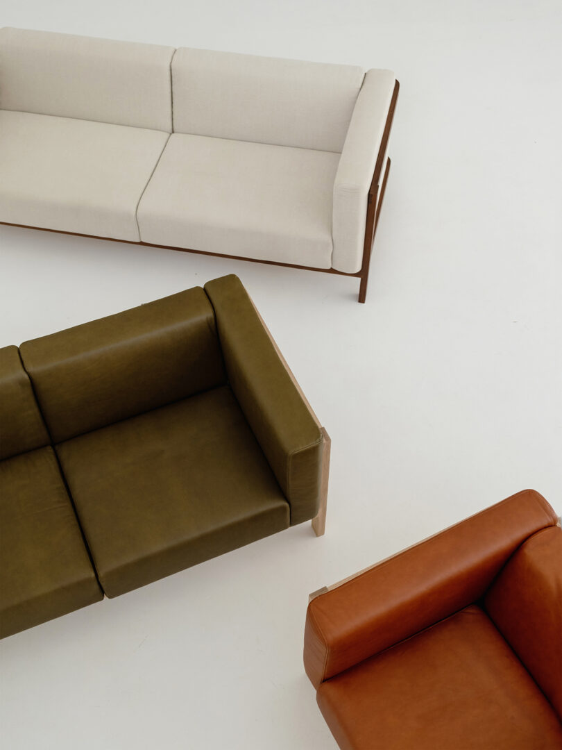 modern cream, olive green, and orange leather sofas