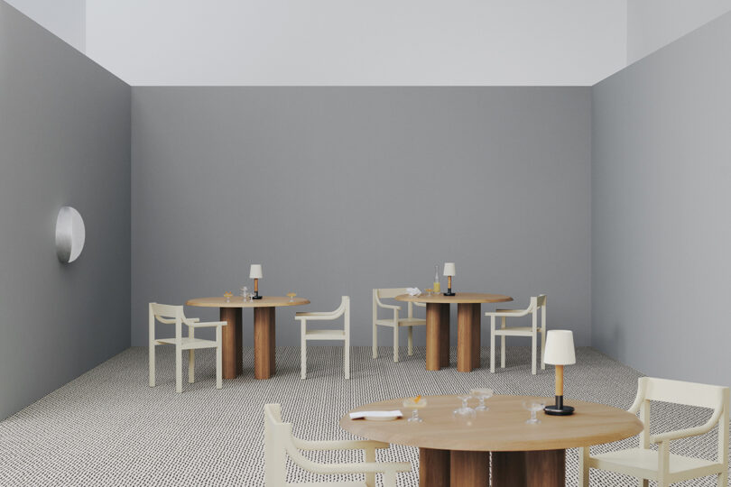 styled dining space with cafe tables, dining chairs, and light grey rug