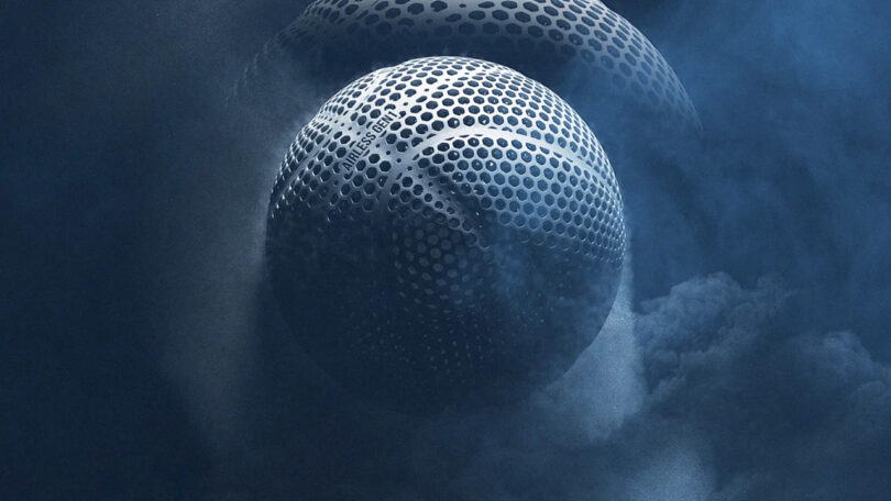 3D render of 3D-printed Wilson Gen1 basketball in blue-gray, emerging from plumes of dust clouds behind it