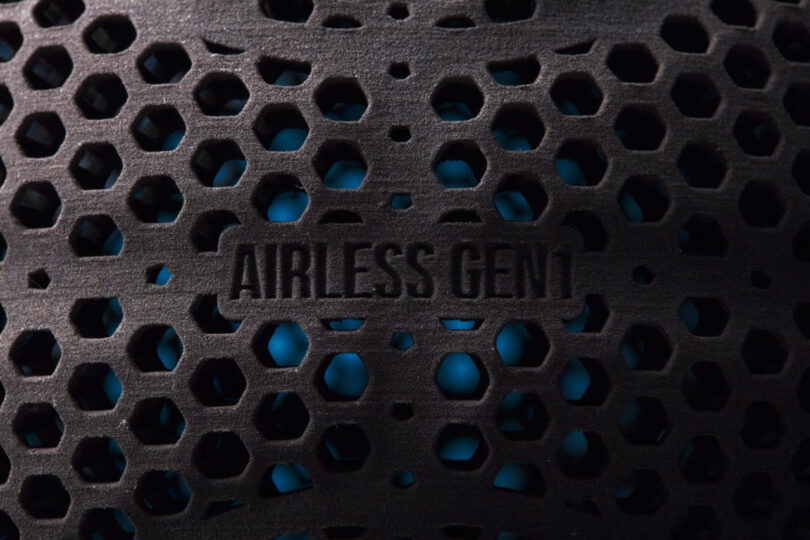 Detail of the all-black additive 3D-printed Wilson Gen1 basketball's small "AIRLESS GEN1" label