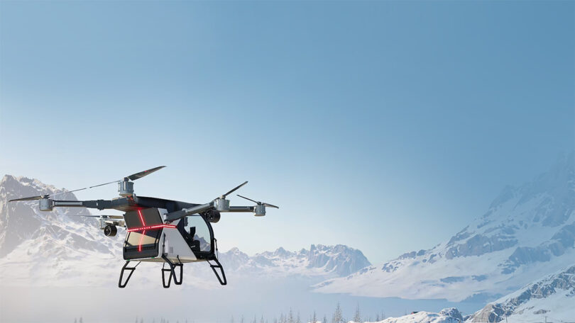 Two-person flying car flying across snow covered mountainous landscape with two occupants.