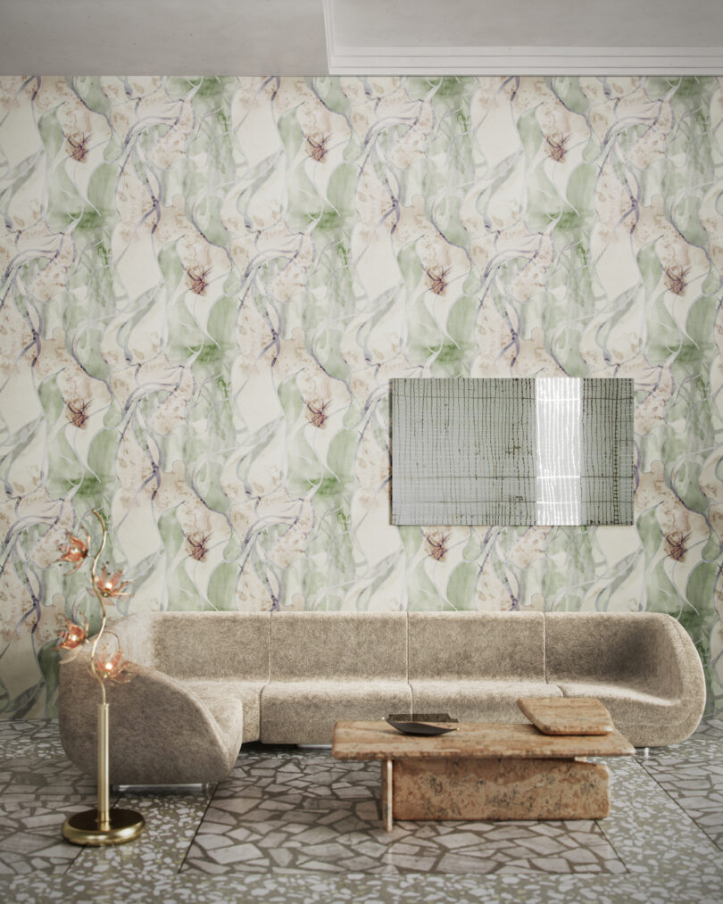 grey sectional in wallpapered room