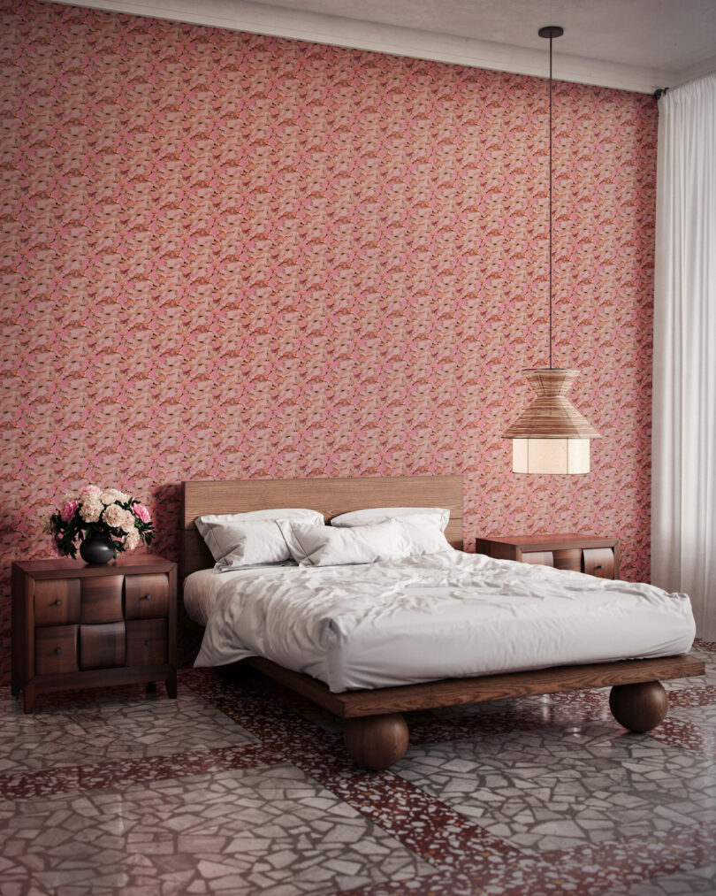 wallpapered bedroom with hanging pendant lamp above bed