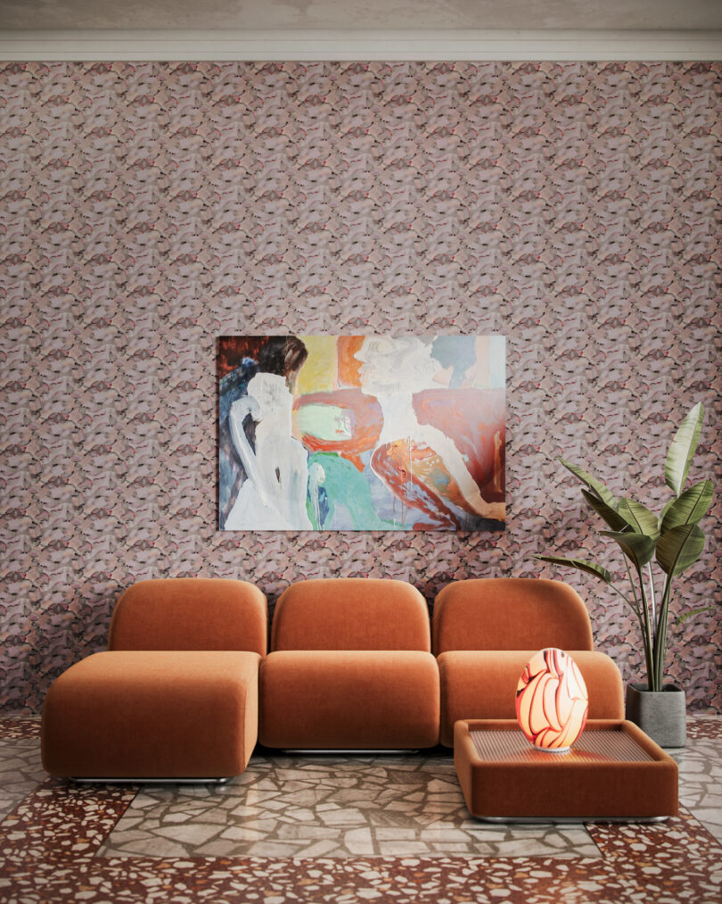 modern orange sofa under abstract painting in wallpapered room