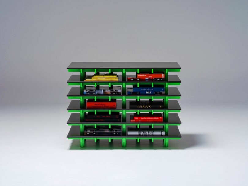 green and black bookshelf resembling architecture
