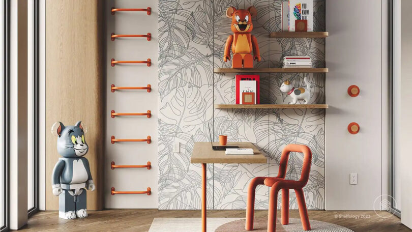 Kid's room decorated with giant Tom and Jerry Kubrick statues with Randle Wall Climbing Handles installed onto the left side of the wall near a small floating desk, tubular chair, floating shelves and decorative plant pattern wallpaper.