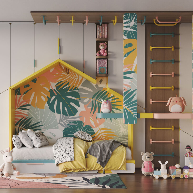 Colorfully decorated kid's room decorated with graphical tropical plant themed wallpaper, children's bed inset into the cross section profile of a yellow roof house, and a multicolor arrangement of Randle Wall Climbing Handles spanning the wall up across the ceiling.
