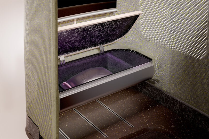 Modern plane cabin seat storage under the feet section, partially opened, revealing additional areas where passengers can keep their belongings during the flight.