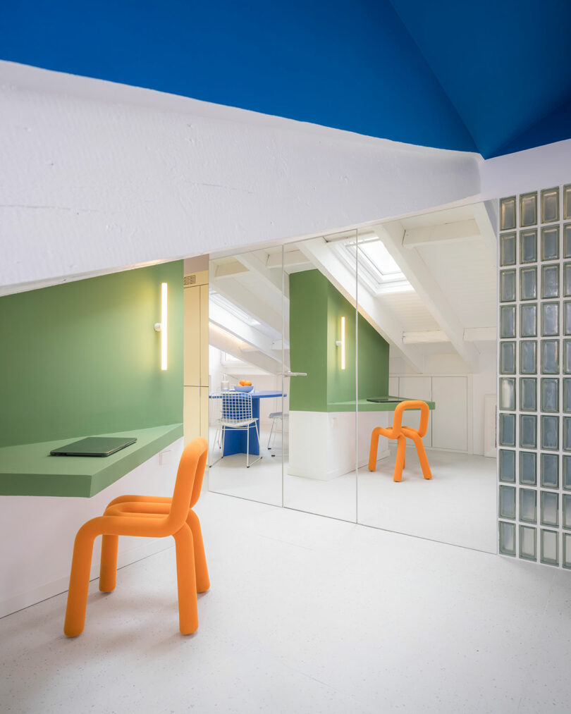 Modern office space with vibrant color accents and a minimalist design.