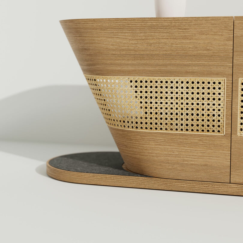 A wooden cat furniture coffee table with a perforated top.