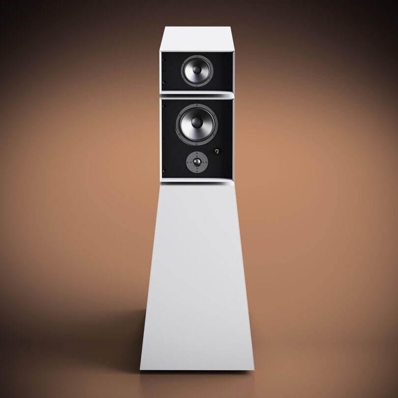 Floor-standing Goldmund Theia wireless speaker on a gradient background.