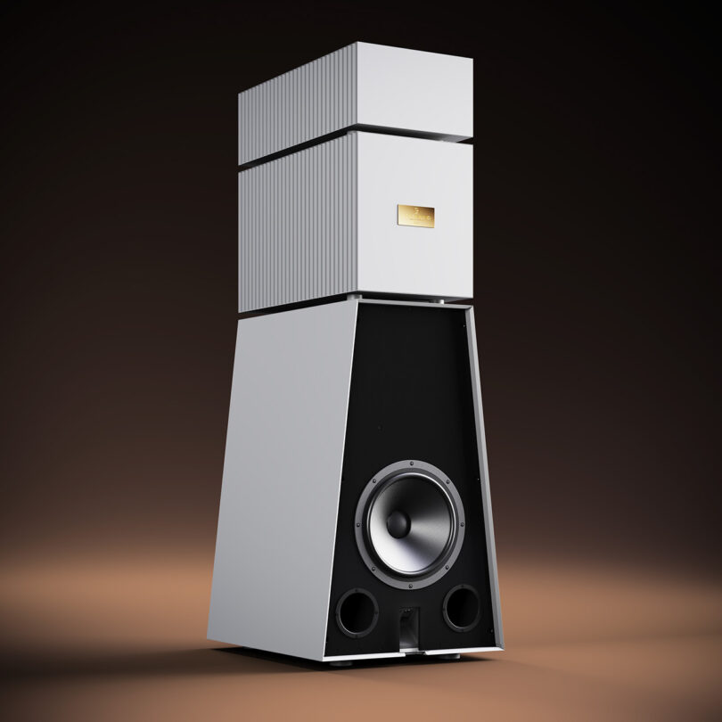 High-end Goldmund Theia floorstanding wireless speakers with a modern design on a gradient background.