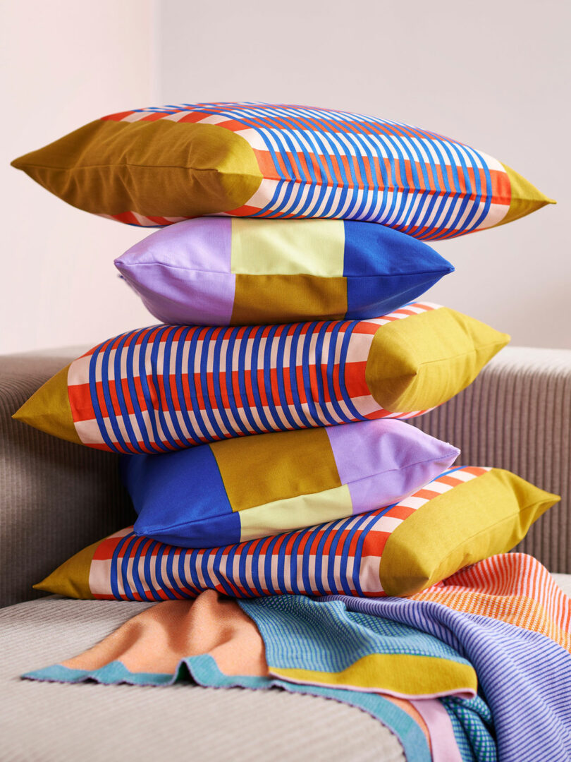 closeup of a stack of 5 colorfully patterned pillows