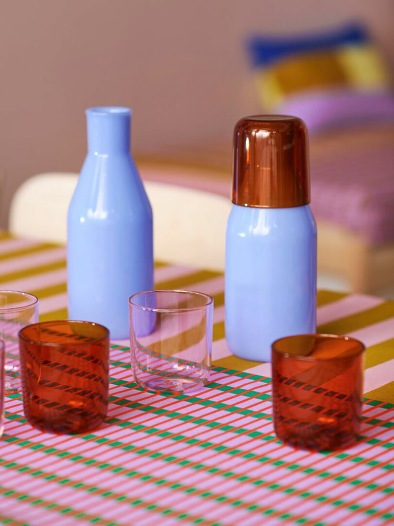 closeup of colorful glass bottles and glasses on a table