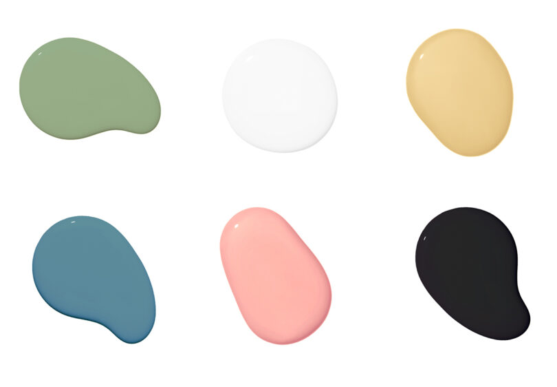 Uma variedade de seis bolinhas de tinta coloridas sobre um fundo branco.