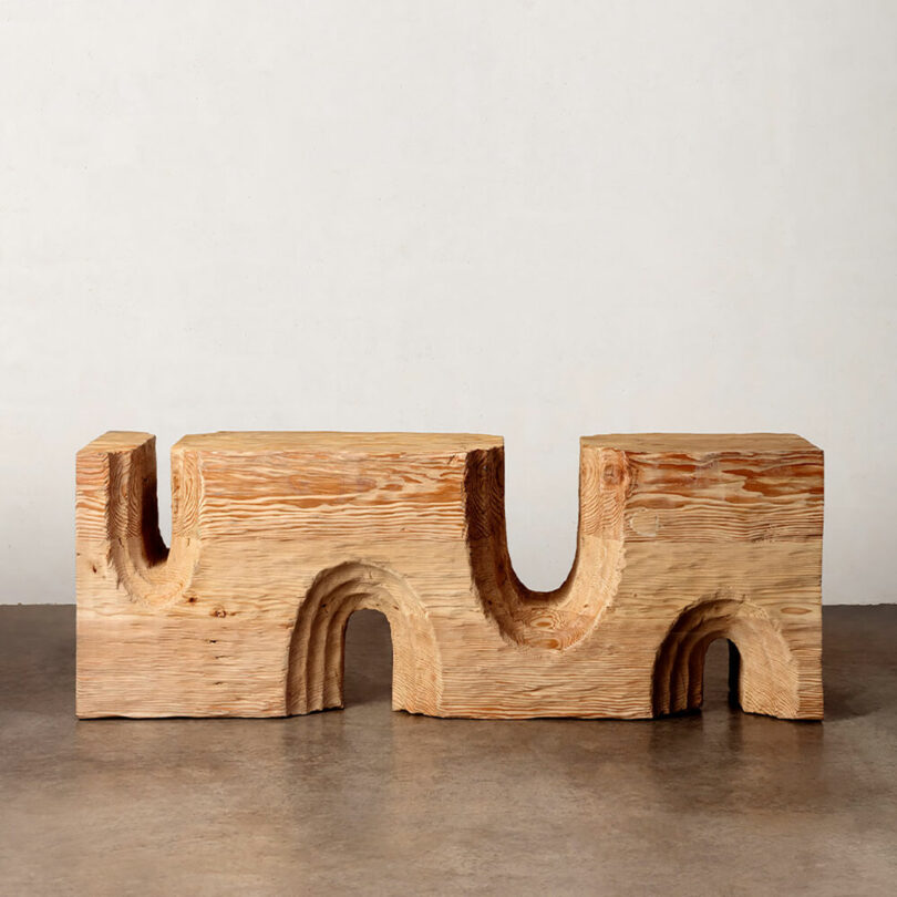 Wooden modular furniture pieces arranged against a neutral background.