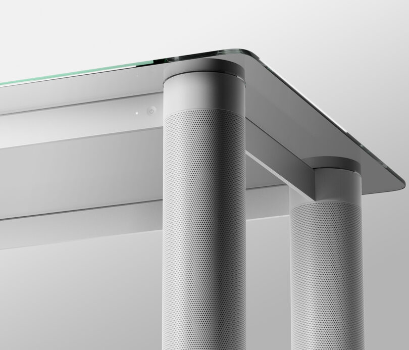 Close-up view of a modern LG Verre speaker coffee table's perforated speaker legs.