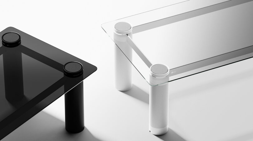 Minimalist LG Verre speaker metal and glass coffee tables with black and white with audio speakers built into each leg.