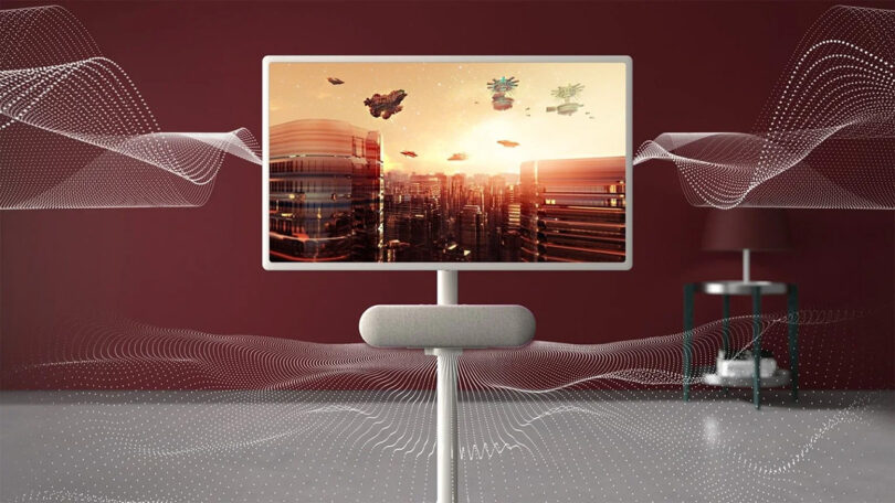 An artistic composition featuring an LG StanbyME Speaker and Rollable Display displaying a futuristic cityscape with elements of nature and technology against a red background with sound wave graphics emanating from the speaker.